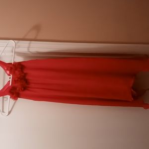 Girls sleeveless dress with designs around the neck ties aroun the neck